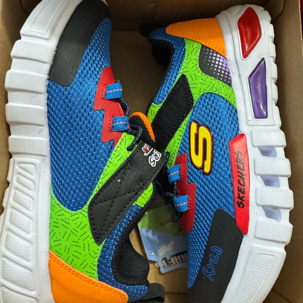 Skechers Ryan’s World tennis shoes 
Little boy